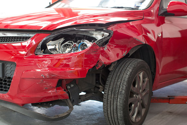 damaged red car